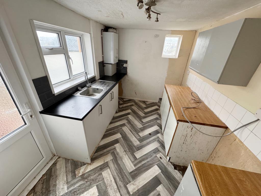 Lot: 138 - TWO-BEDROOM TERRACE HOUSE FOR IMPROVEMENT PLUS ADDITIONAL LAND - Kitchen